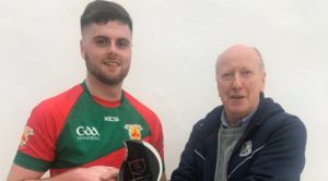 Salthill Men's A Champion: Fergal Coughlan Jnr receives trophy from Pierce Lawlor, Salthill Handball Club.