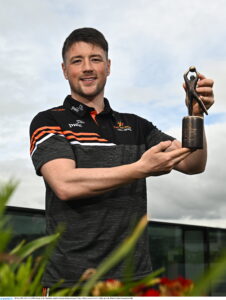 10 May 2023; PwC GAA/GPA Player of the Month for April in football, Keelan Sexton of Clare, with his award at PwCs offices in Cork. Photo by Eóin Noonan/Sportsfile