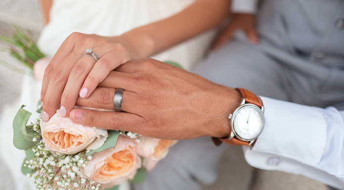 Love & Marriage. Bride and Groom holding hands